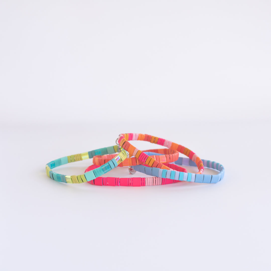 The BAJA Bracelet Stack (5) featuring bright beachy neon colors, perfect for any summer outfit! Shop Current