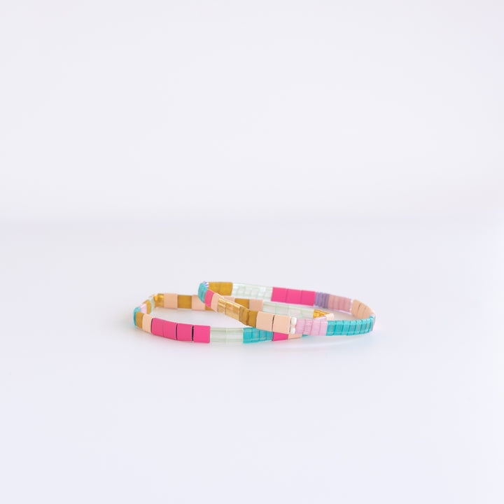 BALBOA Bracelet Stack featuring two vibrant, colorful stretch glass bead bracelets inspired by Balboa Island. Shop Current.