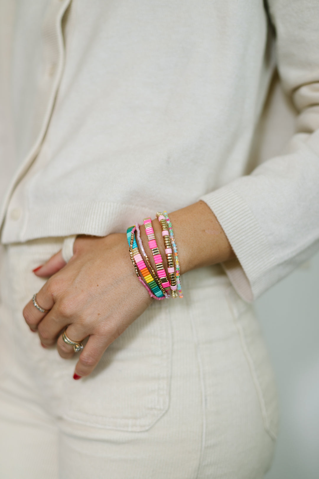 Add some color to your holiday with our Merry and Bright bracelet stack. A mix of Neon colors and gold, with pastel beaded bracelets.