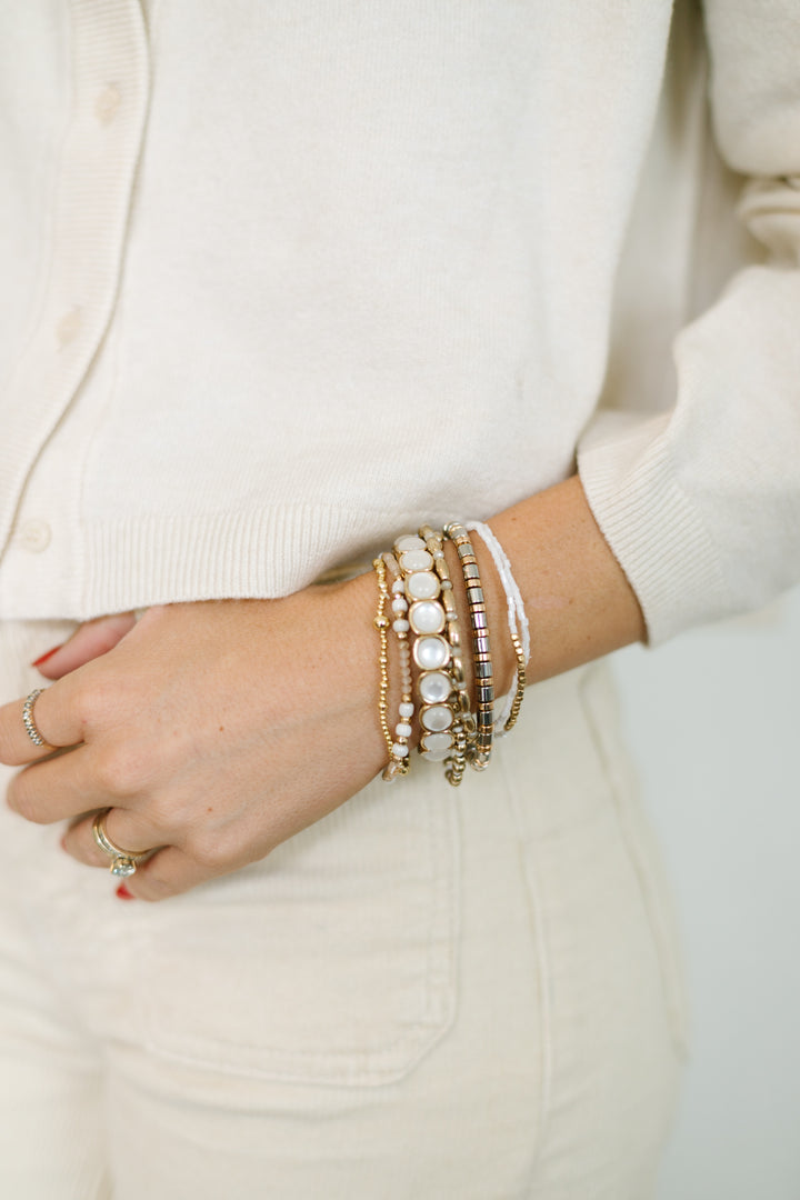 WINTER WHITES CHUNKY BRACELET STACK, SOFT WHITES, SILVER AND GOLD
These WOMENS beaded bracelets are stretchy and comfortable - Shop Current.