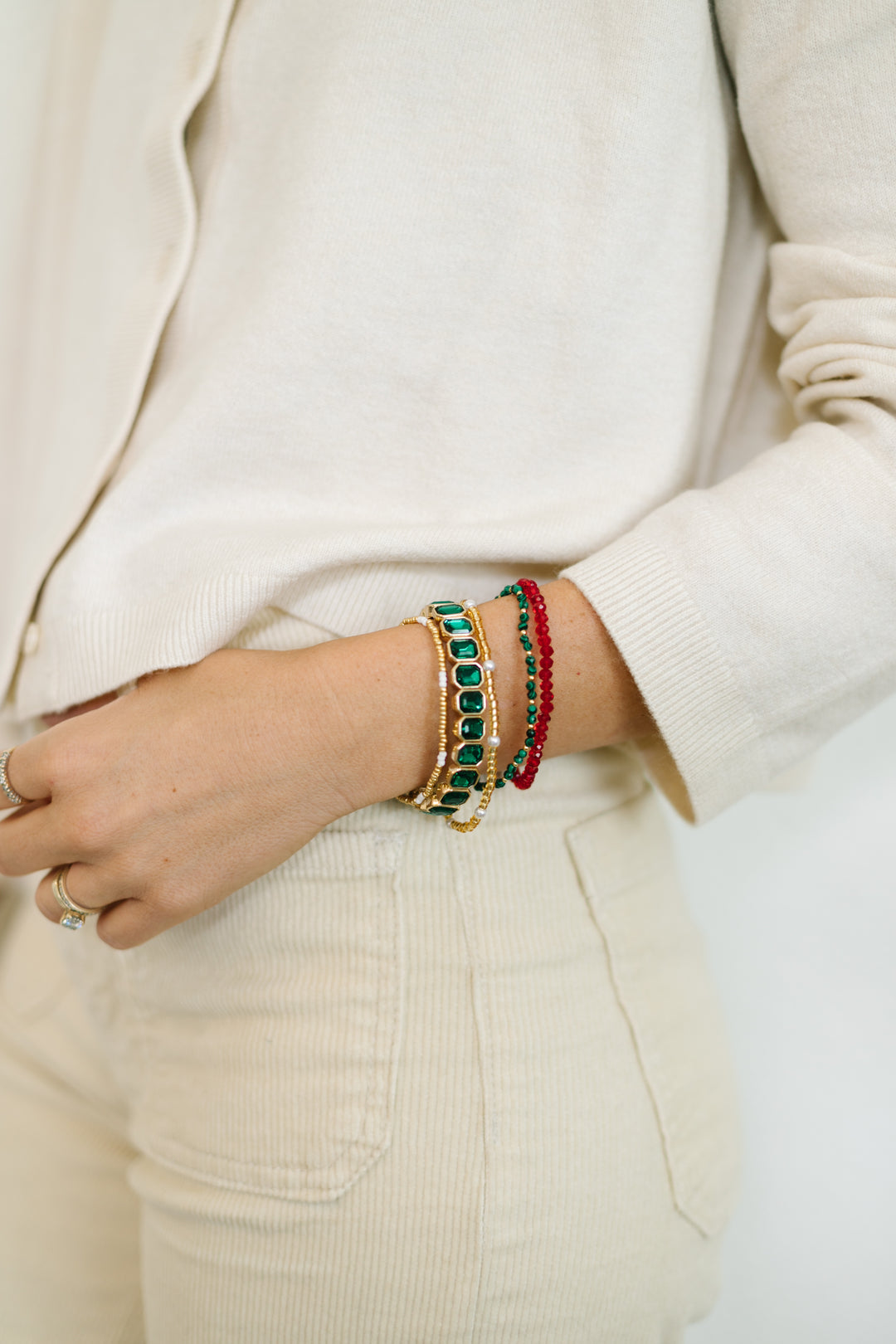 EVERGREEN BRACELET STACK -includes a vibrant emerald gem stretch bracelet, paired with dainty pearl, evergreen, and ruby gem bracelets.