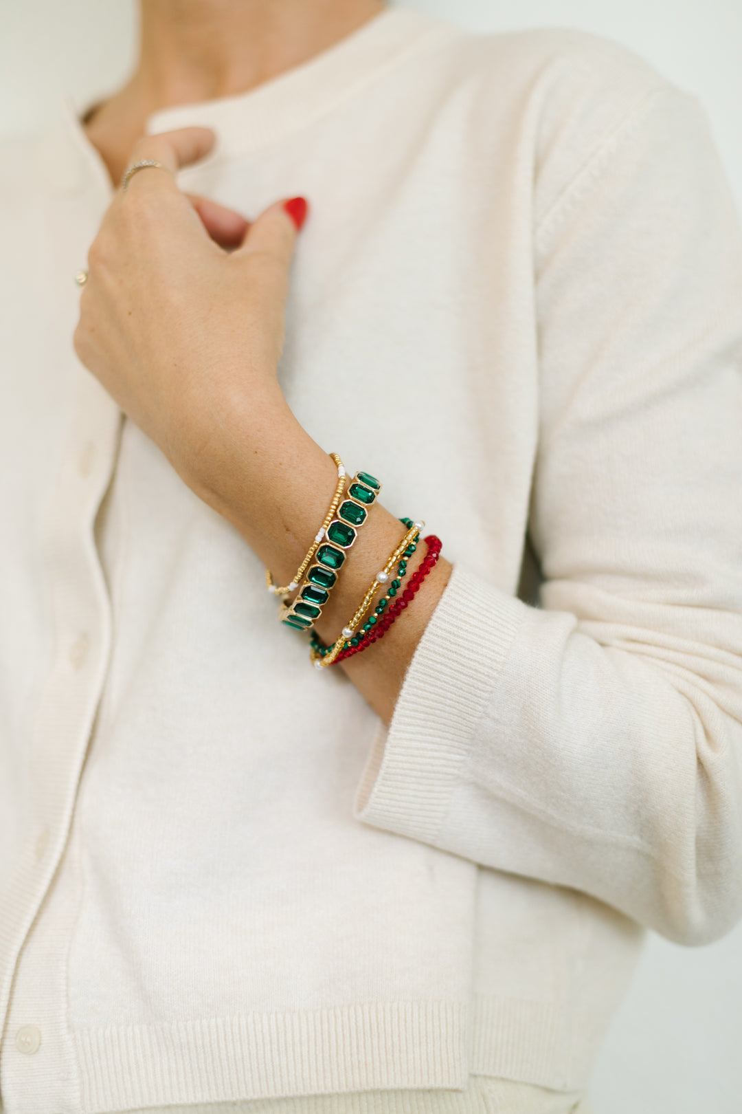 EVERGREEN BRACELET STACK -includes a vibrant emerald gem stretch bracelet, paired with dainty pearl, evergreen, and ruby gem bracelets.