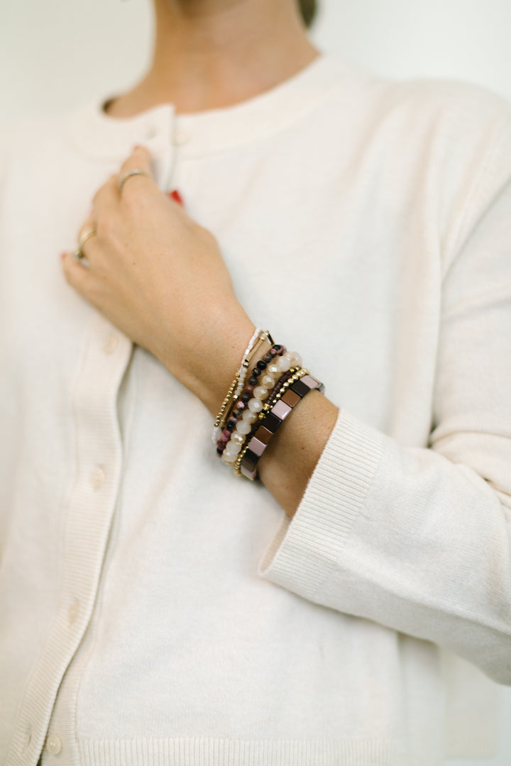 CRANBERRY BRACELET STACK. BOHO bracelets in beautiful earth tones, d with brown, MAUVE and gold accents. Paired with sparkling white jade bracelets