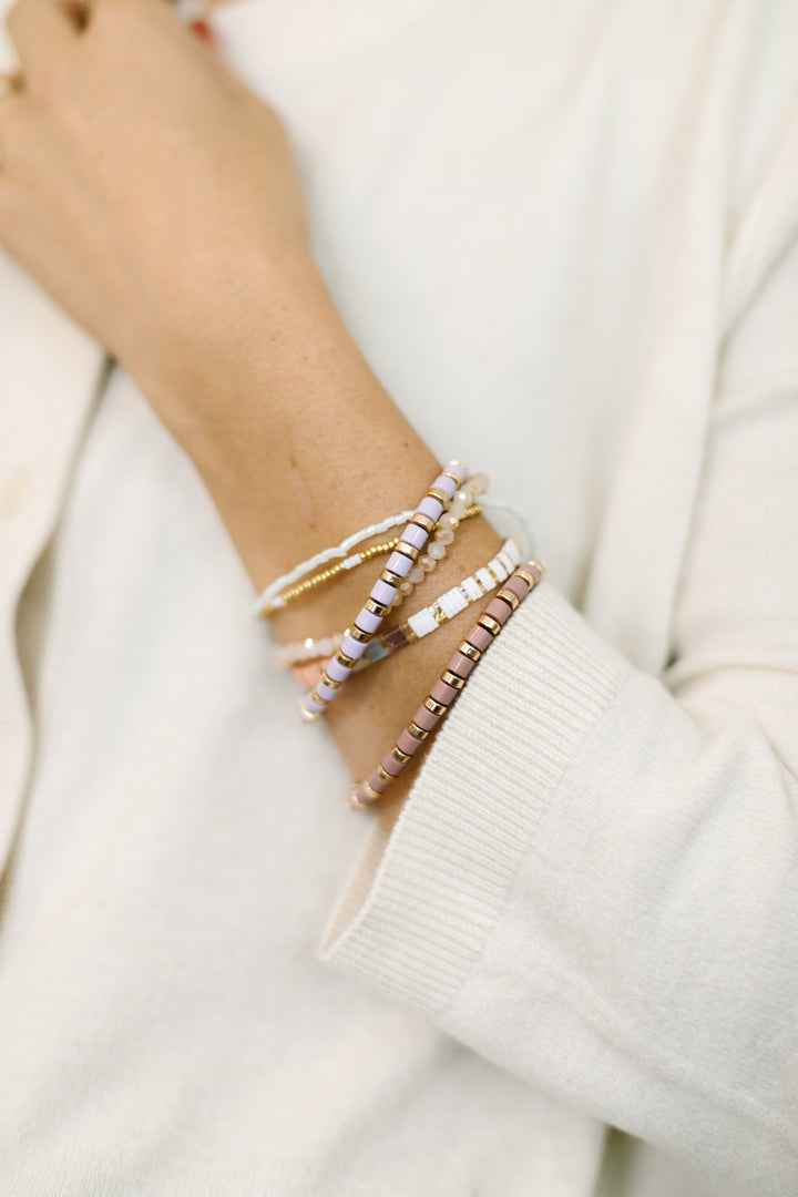 SUGARPLUM Bracelet Stack! This playful set blends gold and soft pastel tones, and sparkling glass bead bracelets