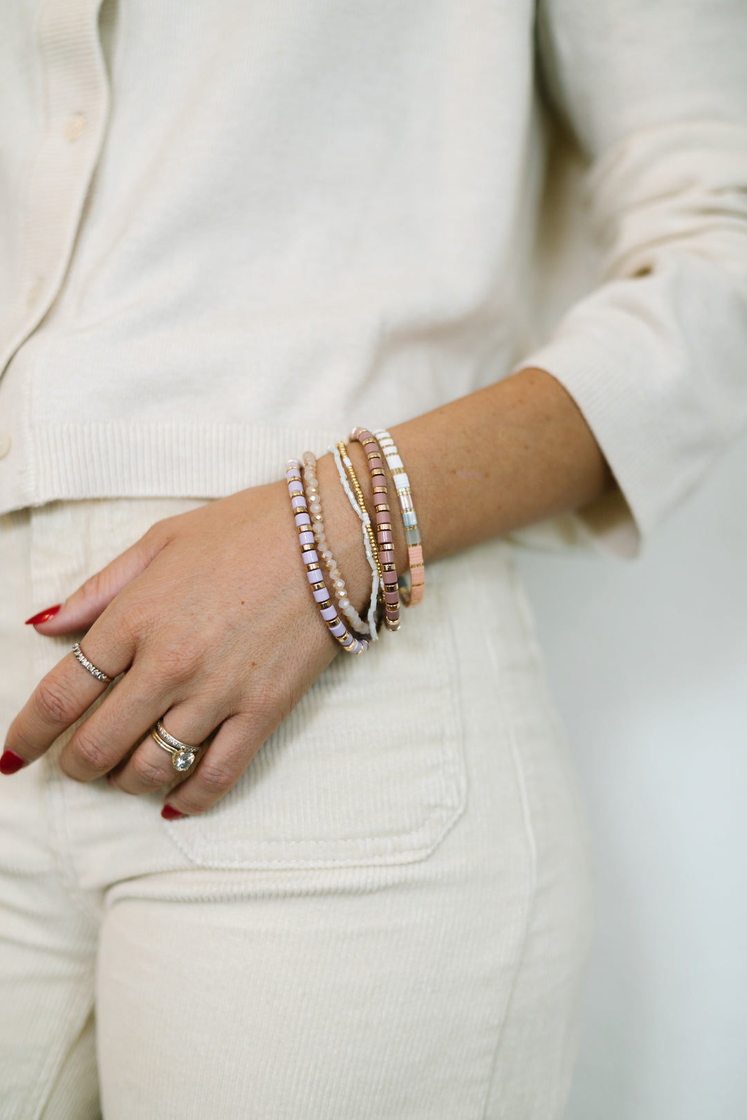 SUGARPLUM Bracelet Stack! This playful set blends gold and soft pastel tones, and sparkling glass bead bracelets