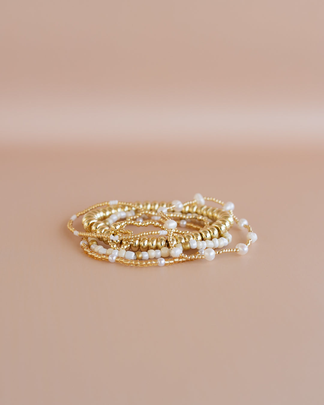 Golden Glow Bracelet Stack! stretch bracelets, beautifully gold and white tones with elegant pearl accents.