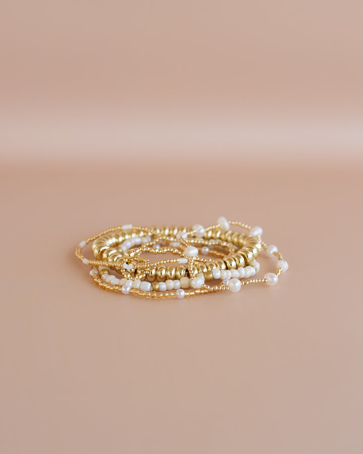 Golden Glow Bracelet Stack! stretch bracelets, beautifully gold and white tones with elegant pearl accents.