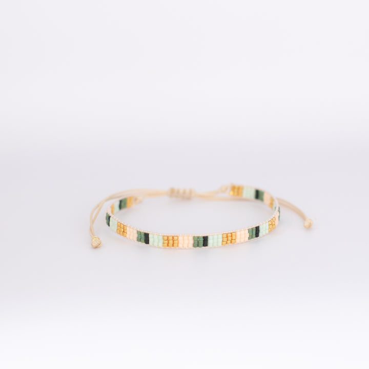 Elegant EMERALD BAY LUXE bracelets featuring vibrant green and gold accents | Current