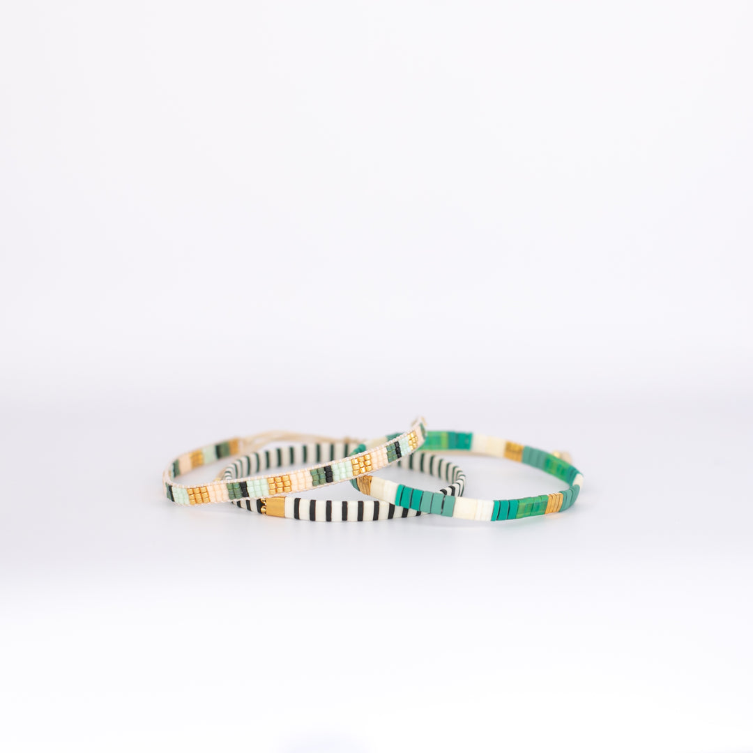 EMERALD BAY LUXE bracelet stack with green, gold, black, and cream beads | Current